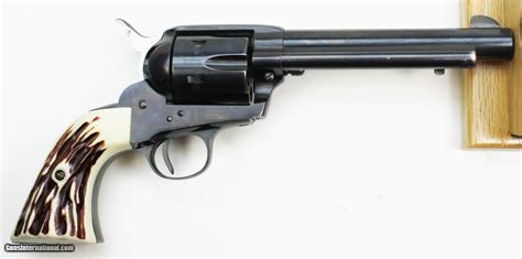 (see attachments) it has a 5-12 inch barrel, wooden grip and sn is GW907. . Great western revolver value